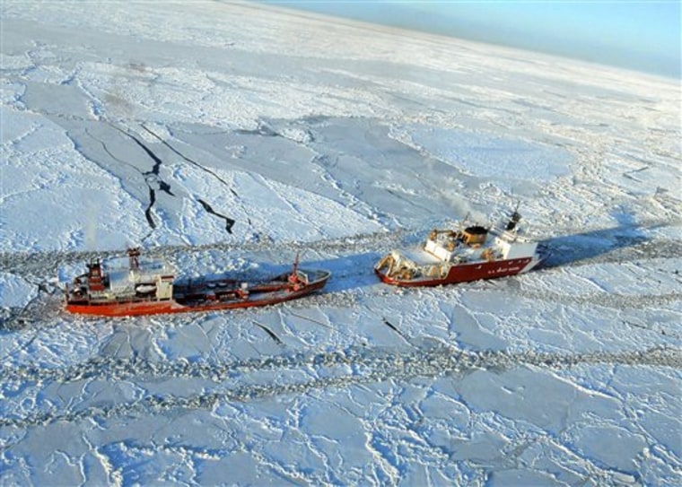 The Coast Guard Cutter Healy escorts the Russian-flagged tanker Renda 250 miles south of Nome on Friday, making their way through ice up to five-feet thick.